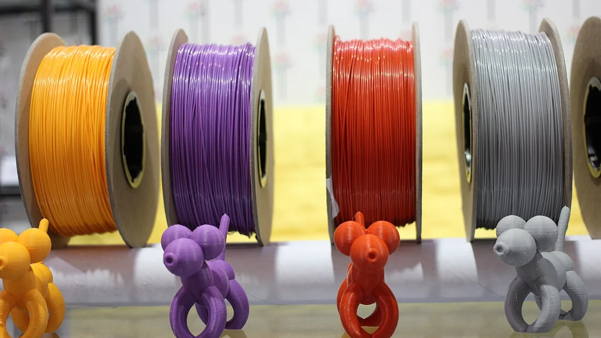 3D printer filament spools organized on a workspace